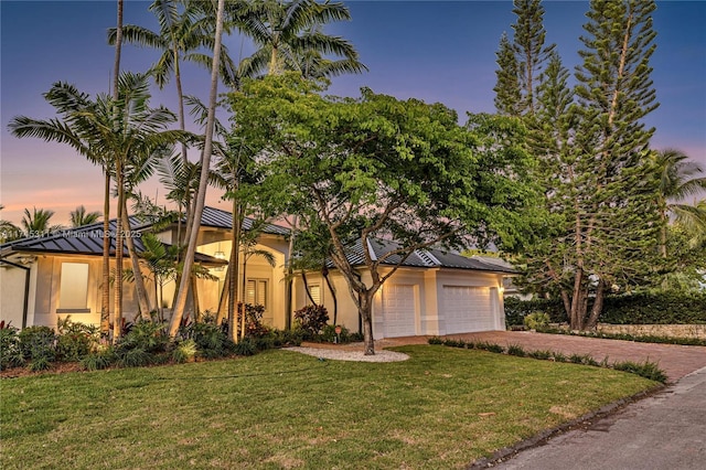 view of home's exterior featuring a yard, fence, and stucco siding