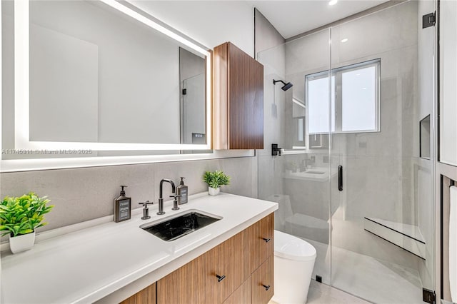 bathroom with vanity, a shower stall, toilet, and decorative backsplash