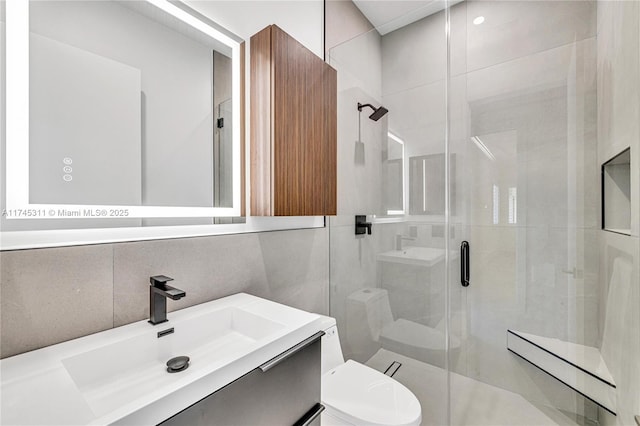 full bathroom with toilet, tile walls, a shower stall, decorative backsplash, and vanity