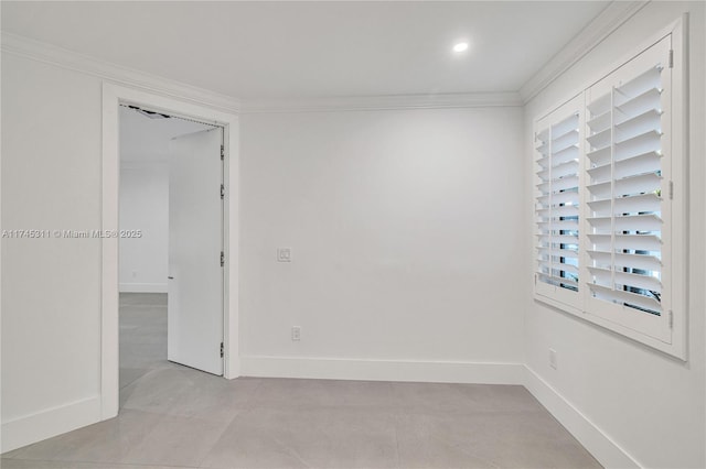 empty room with crown molding, recessed lighting, and baseboards