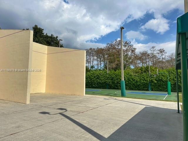 view of patio / terrace featuring community basketball court