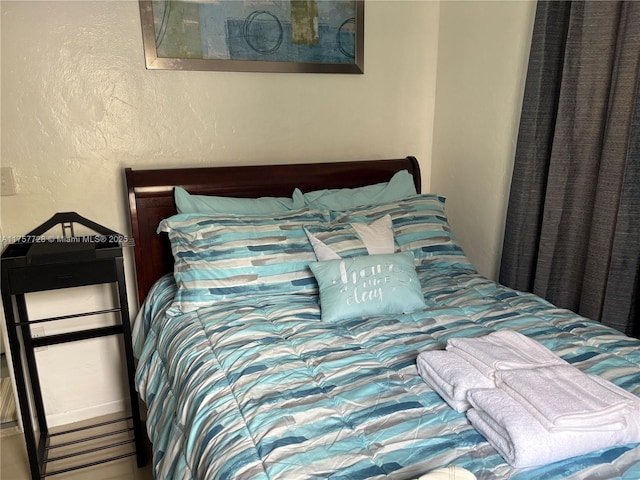 bedroom with a textured wall