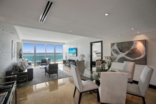 dining area featuring a wall of windows, recessed lighting, and visible vents