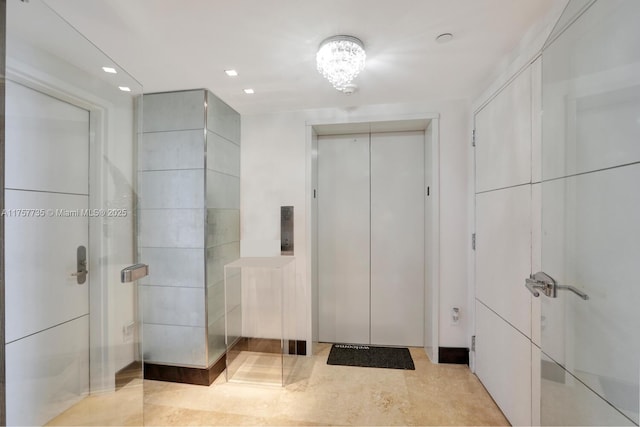 bathroom featuring recessed lighting and elevator