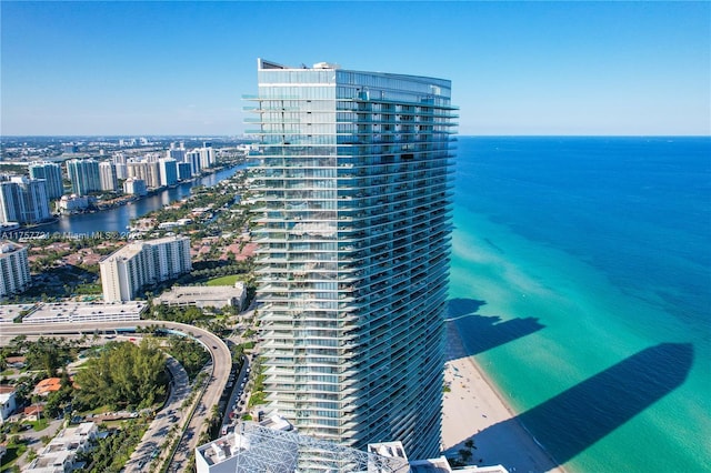 birds eye view of property with a city view and a water view