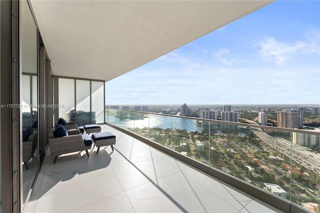 balcony with a view of city and a water view