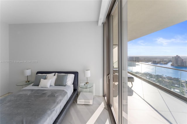 bedroom featuring a water view