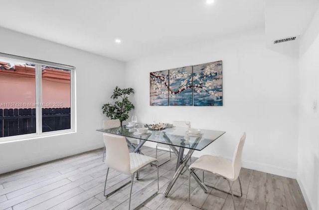 dining area with visible vents, recessed lighting, light wood-style flooring, and baseboards