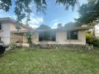 60 NW 143rd St, Miami, FL 33168 - back of house with a yard