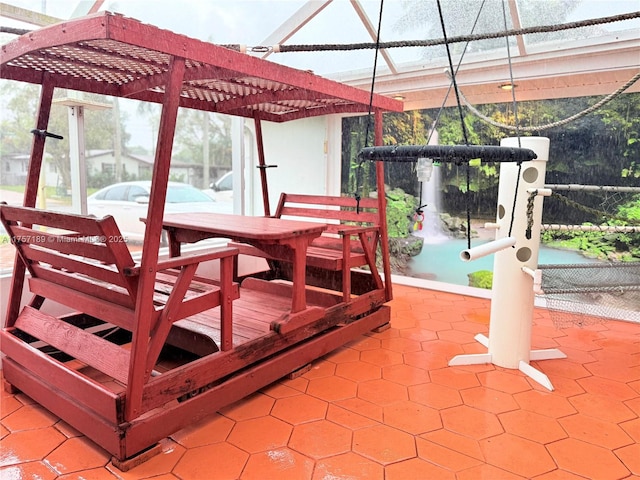 exterior space featuring outdoor dining area and a pergola
