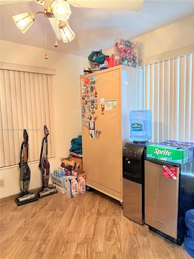 storage area with a ceiling fan