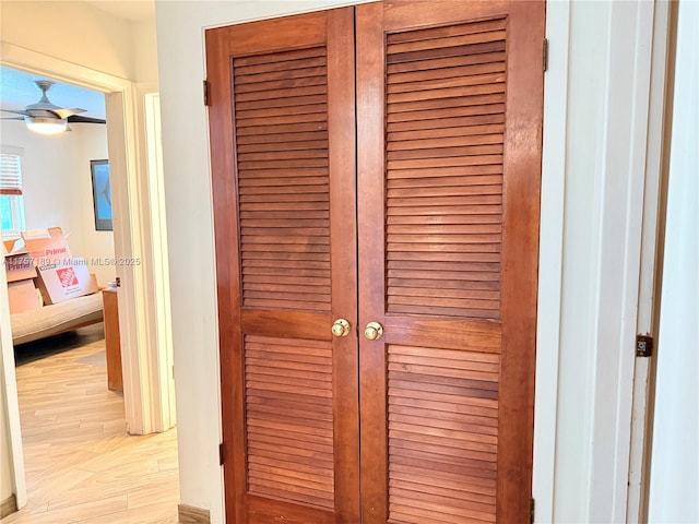 room details featuring a ceiling fan and wood finished floors