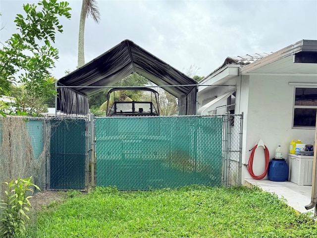 exterior space featuring fence and a gate