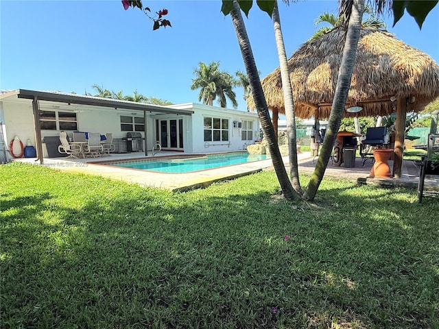 exterior space with a patio and a yard