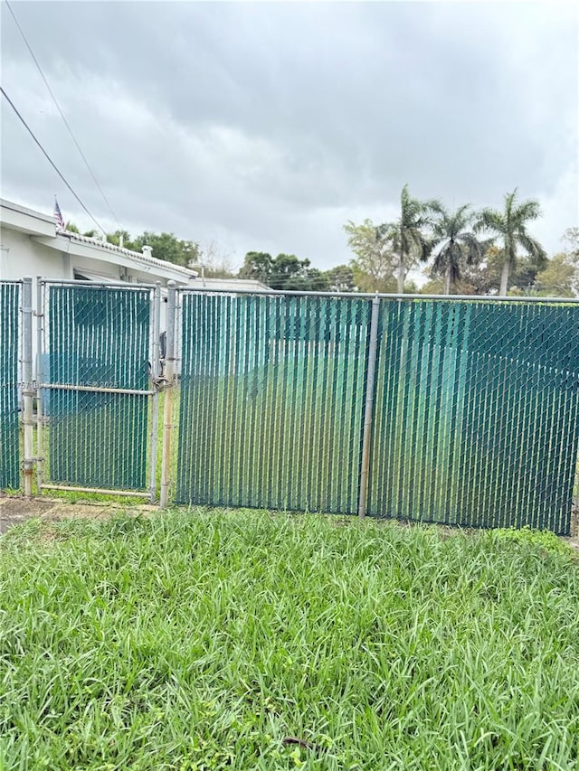 view of gate with fence