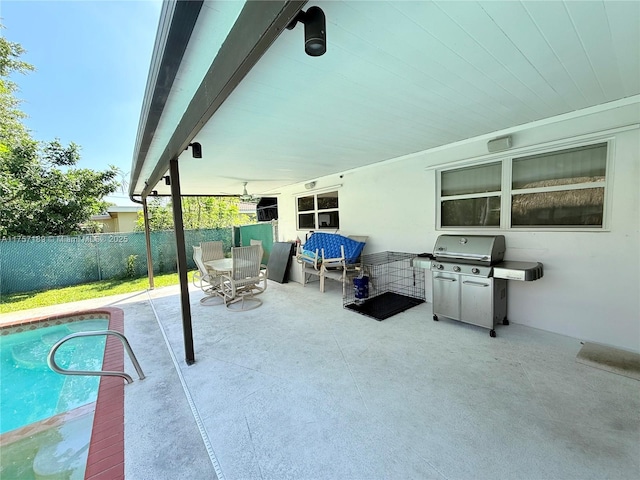 view of patio / terrace featuring a fenced in pool, grilling area, and fence