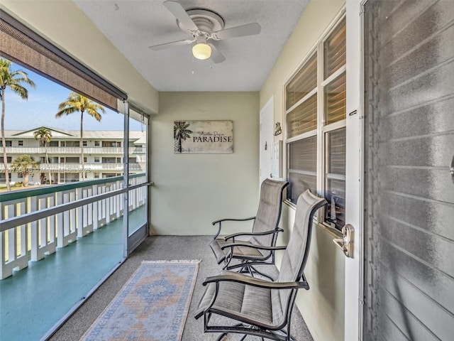 balcony featuring a ceiling fan