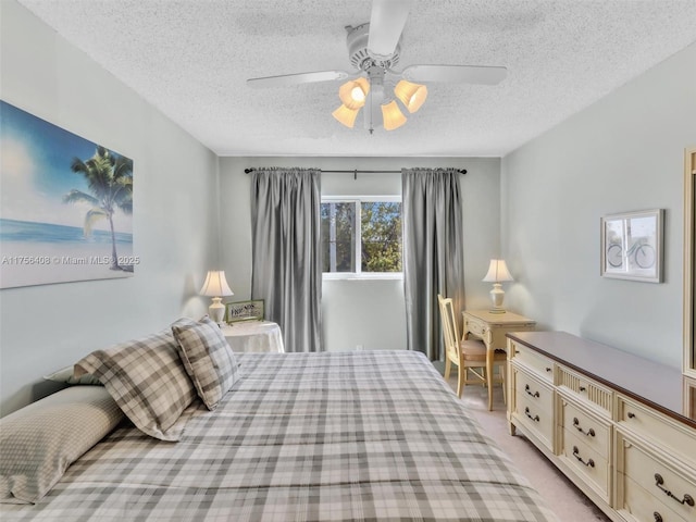 bedroom with light carpet, a textured ceiling, and a ceiling fan