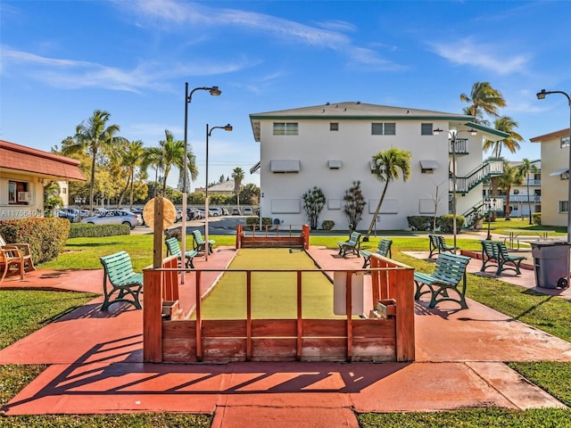 view of home's community featuring a lawn