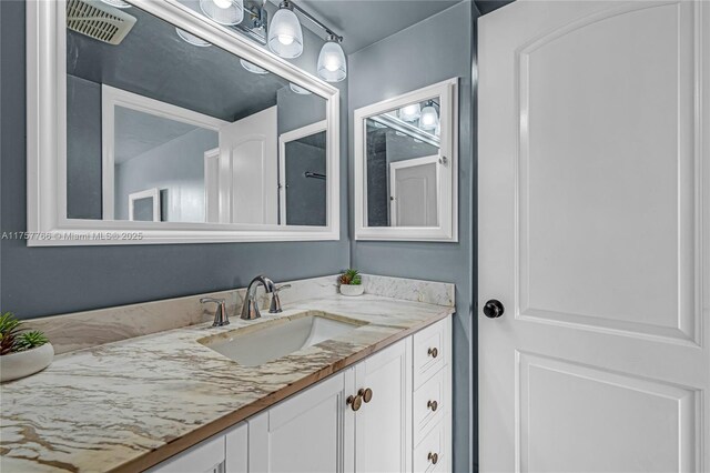 bathroom featuring visible vents and vanity