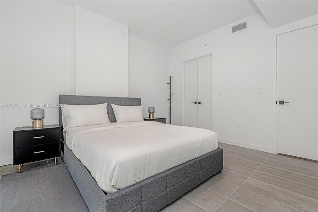 bedroom with visible vents and baseboards