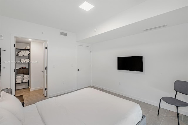 bedroom with visible vents and baseboards