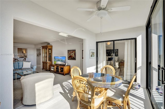 dining space with a ceiling fan