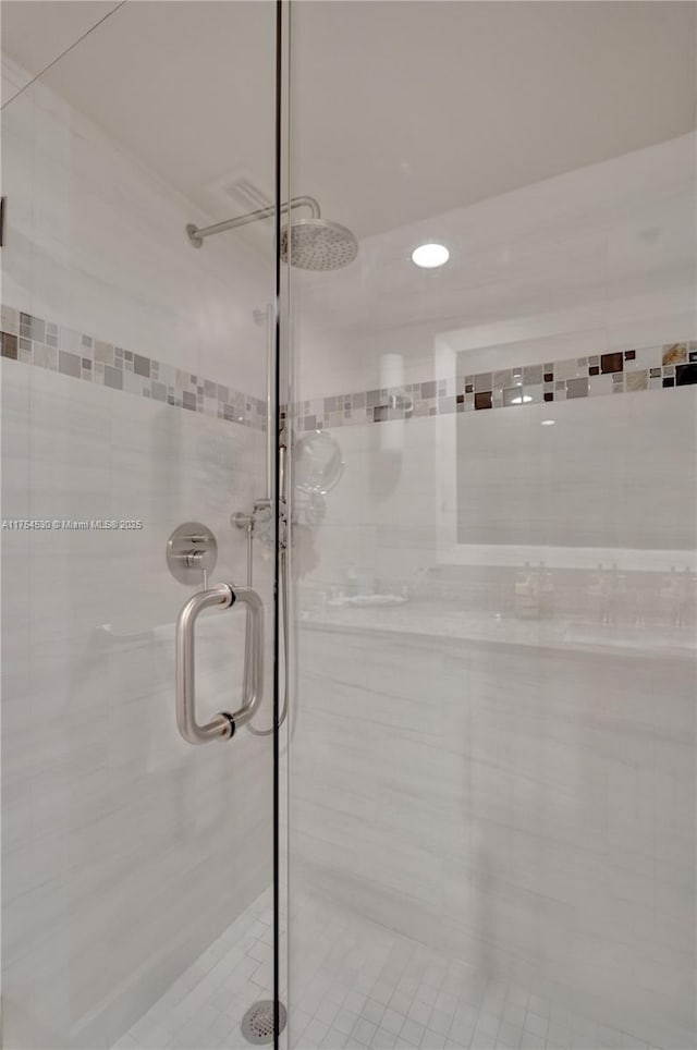 bathroom featuring a shower stall