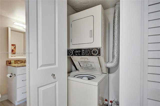 washroom featuring stacked washing maching and dryer and laundry area