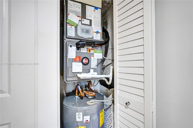 utility room with water heater