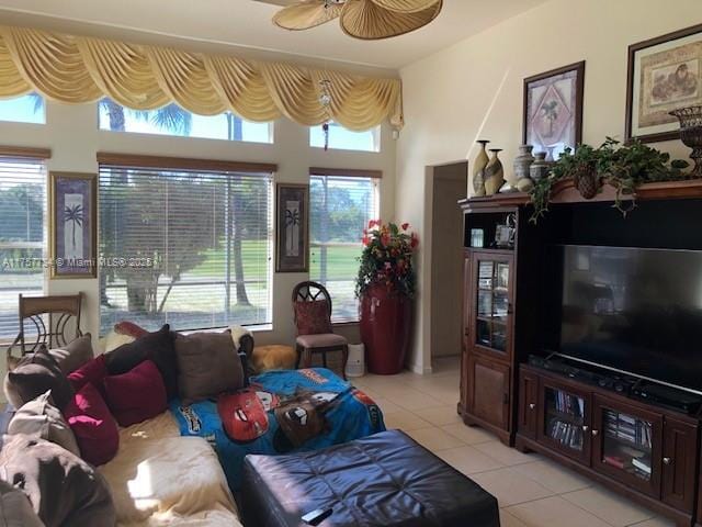 sunroom / solarium featuring a ceiling fan and a healthy amount of sunlight