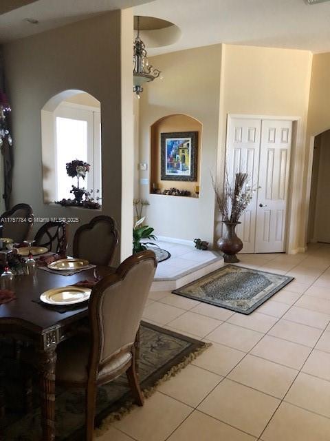 dining area with light tile patterned floors