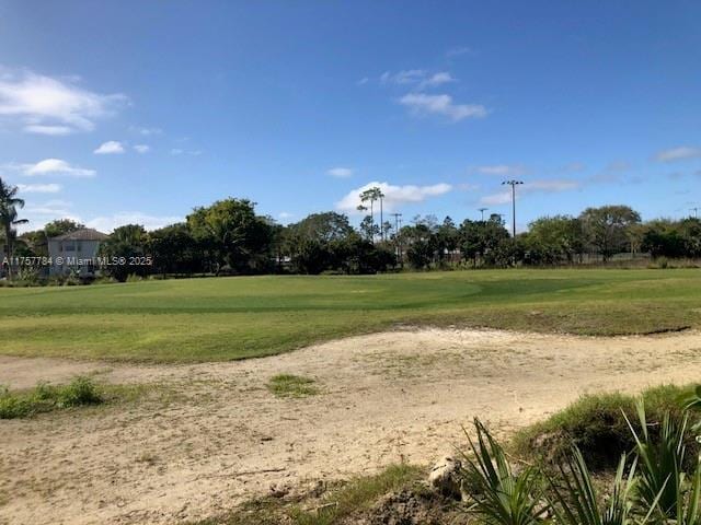 view of home's community with a lawn