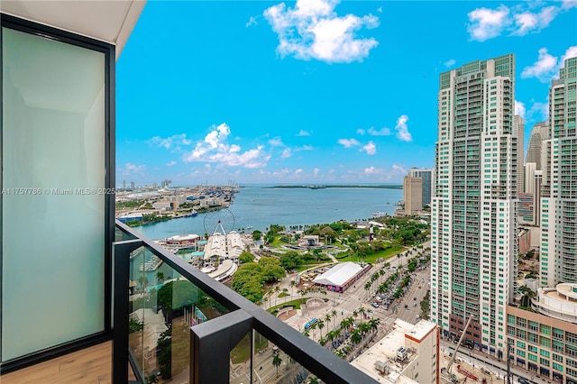 balcony with a water view and a city view