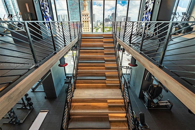 staircase featuring a view of city