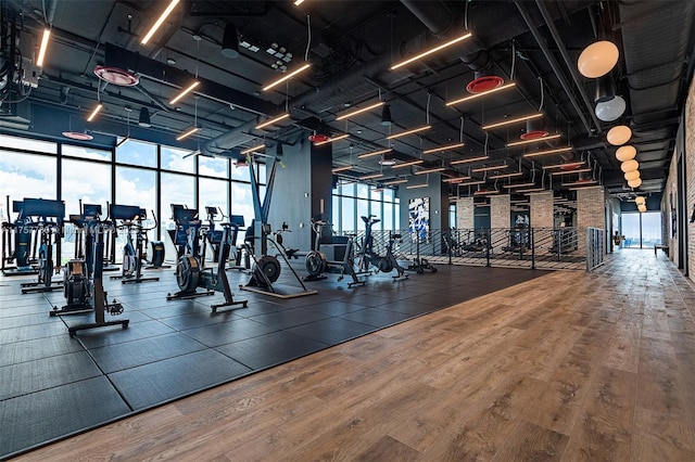 gym with wood finished floors