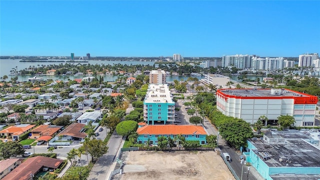 aerial view featuring a water view and a view of city