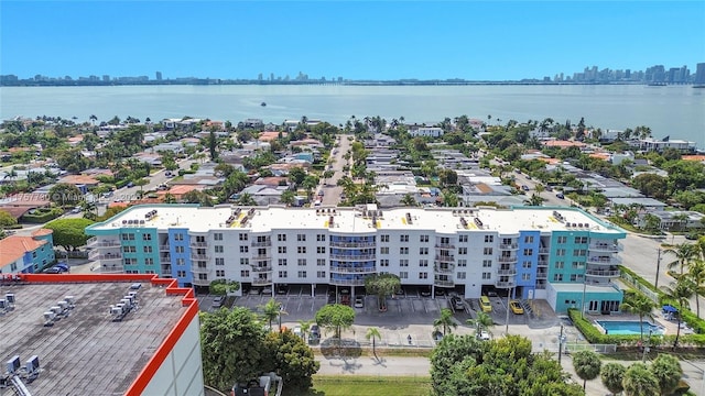 aerial view featuring a view of city and a water view