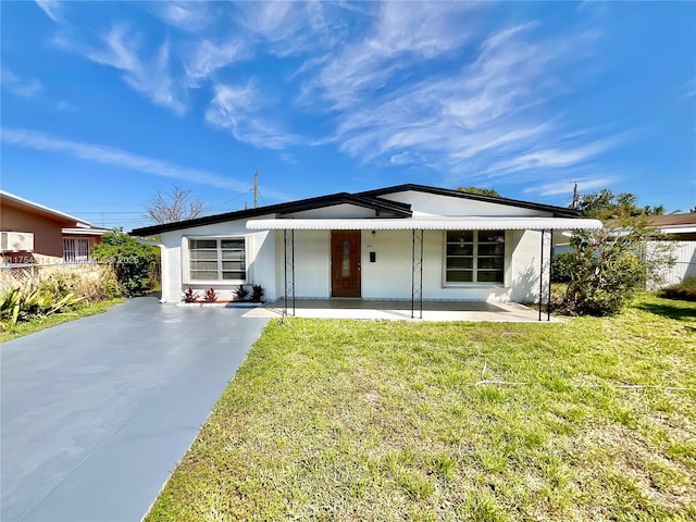 view of front facade featuring a front lawn and stucco siding