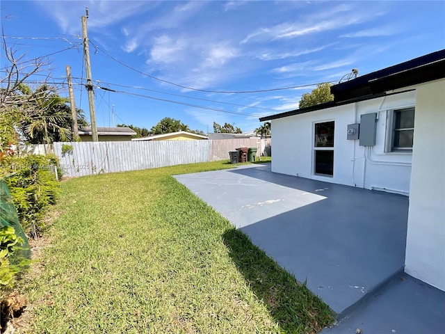 view of yard with a patio area and fence