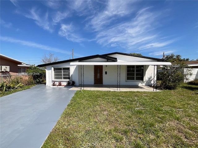 view of front of property with a front lawn and stucco siding