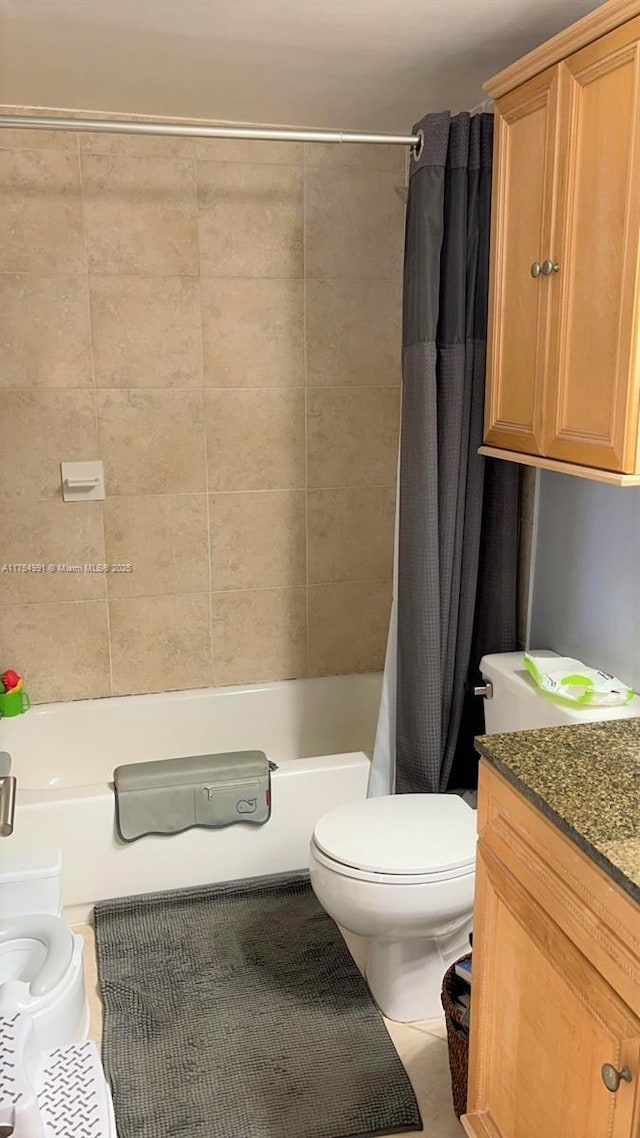 full bathroom featuring toilet, shower / tub combo, vanity, and tile patterned floors