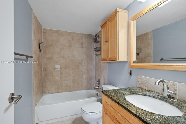 full bath with tile patterned flooring, bathing tub / shower combination, vanity, and toilet