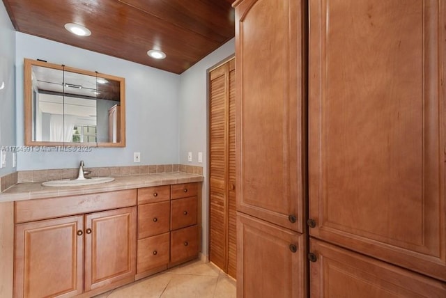 bathroom with recessed lighting, a closet, wood ceiling, vanity, and tile patterned flooring