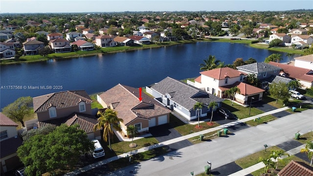 aerial view with a residential view and a water view