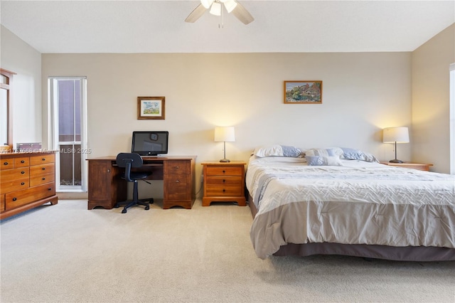 bedroom featuring light carpet and a ceiling fan