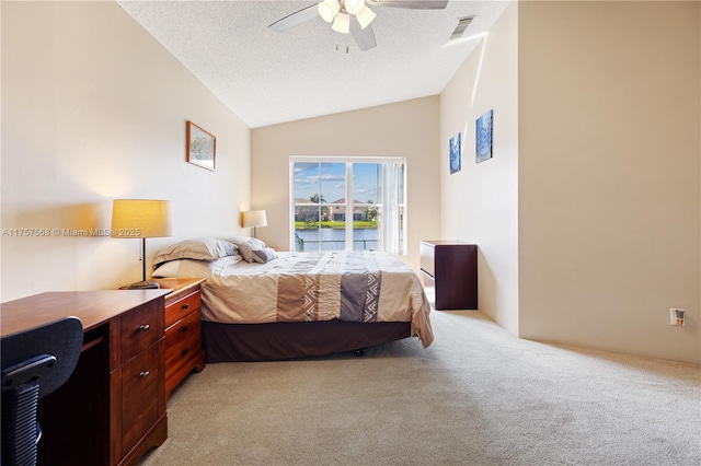 bedroom with a textured ceiling, lofted ceiling, light colored carpet, a ceiling fan, and access to outside