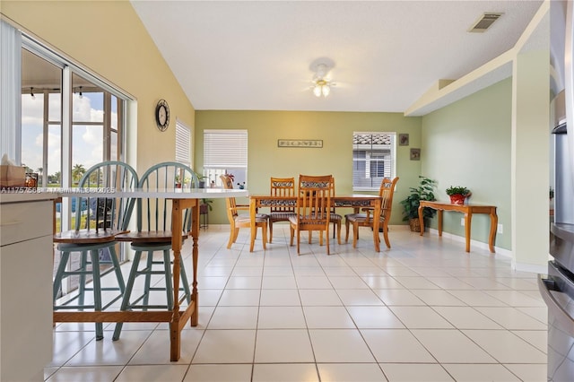 dining space featuring visible vents, baseboards, and light tile patterned floors