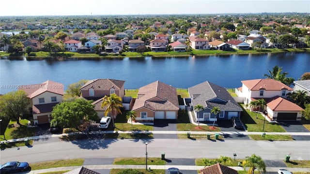 aerial view featuring a residential view and a water view