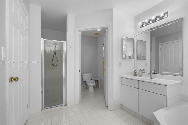 full bathroom featuring a stall shower, toilet, a tub, tile patterned floors, and vanity